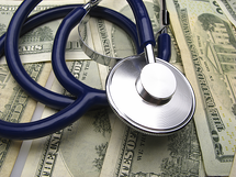 Stethoscope on background of money