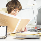 Woman Reading Paperwork